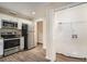 Efficient kitchen featuring stainless steel appliances, white cabinetry, and laundry hook ups at 1146 Canal St, Decatur, GA 30032
