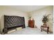Unfinished basement area with tile floors, a decorative headboard and a wood dresser at 1412 Great Shoals Dr, Lawrenceville, GA 30045