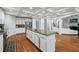 Open kitchen with granite counters, stainless appliances, and view into living area at 1412 Great Shoals Dr, Lawrenceville, GA 30045