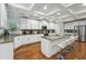 Gourmet kitchen with granite countertops, stainless steel appliances, and a central island with bar seating at 1412 Great Shoals Dr, Lawrenceville, GA 30045