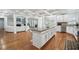 Open concept kitchen featuring granite countertops, stainless steel appliances, and a center island with bar stools at 1412 Great Shoals Dr, Lawrenceville, GA 30045