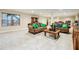 Finished basement living room with tile floors and natural light from the window at 1412 Great Shoals Dr, Lawrenceville, GA 30045
