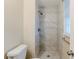 Modern bathroom features a stand up shower with marble-patterned tile surround and bronze fixtures at 2202 Troutdale Dr, Decatur, GA 30032