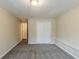 Bedroom featuring carpet flooring, ample closet space, and neutral wall color at 2202 Troutdale Dr, Decatur, GA 30032