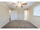 Bedroom with ceiling fan, carpet flooring, closet, and ensuite bathroom at 2202 Troutdale Dr, Decatur, GA 30032