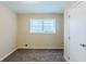Bedroom featuring carpet flooring and a large window providing natural light at 2202 Troutdale Dr, Decatur, GA 30032