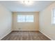 Neutral bedroom is bright with natural light from the two windows at 2202 Troutdale Dr, Decatur, GA 30032