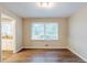 Dining room with wood floors and a view of the backyard through a window at 2202 Troutdale Dr, Decatur, GA 30032