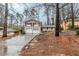 Split-level home with white brick, black shutters, two-car garage, and red front door at 2202 Troutdale Dr, Decatur, GA 30032
