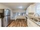 Bright kitchen featuring stainless steel appliances and granite countertops at 2202 Troutdale Dr, Decatur, GA 30032