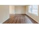 Bright living room with wood floors and a large window with blinds at 2202 Troutdale Dr, Decatur, GA 30032