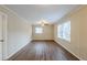 Spacious living room with wood-look floors, neutral walls, and ample natural light at 2202 Troutdale Dr, Decatur, GA 30032