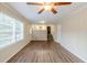 Inviting living room with open floor plan, featuring wood-look floors and bright natural light at 2202 Troutdale Dr, Decatur, GA 30032