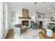 Open-concept living room and kitchen area featuring a cozy fireplace and modern appliances, perfect for entertaining and relaxation at 2390 Edgar Park Pl # 102, Duluth, GA 30096