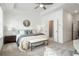 Bright main bedroom boasts natural light, tray ceilings, and convenient ensuite bathroom at 2390 Edgar Park Pl # 102, Duluth, GA 30096