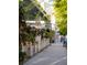 Street view showcasing commercial buildings, the Pure Taqueria restaurant and landscaped sidewalks at 2390 Edgar Park Pl # 102, Duluth, GA 30096