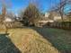 Spacious backyard with a wood fence and mature trees providing ample privacy at 3782 Westchase Dr, Marietta, GA 30066