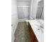 Functional bathroom with a shower-tub combo, neutral flooring, and vanity with storage at 3782 Westchase Dr, Marietta, GA 30066
