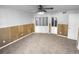 Spacious bedroom with neutral carpet, wood paneled walls, and great closet space at 3782 Westchase Dr, Marietta, GA 30066