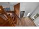 Wood spiral staircase with modern chandelier and an open floor plan at 3782 Westchase Dr, Marietta, GA 30066