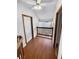 Hallway with wood floors and railing overlooking chandelier at 3782 Westchase Dr, Marietta, GA 30066