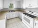 All-white kitchen features appliances and plenty of cabinet storage at 3782 Westchase Dr, Marietta, GA 30066