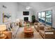 Bright, staged living room with vaulted ceilings, fireplace, and natural light at 3782 Westchase Dr, Marietta, GA 30066