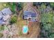 Aerial shot of the property, featuring the home, large yard, and private pool at 805 Wesley Oak Rd, Atlanta, GA 30328