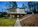 Rear view of the house, showing a spacious deck and walkout basement at 805 Wesley Oak Rd, Atlanta, GA 30328