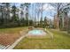 An inviting pool area surrounded by a wooden fence and spacious lawn, perfect for relaxation at 805 Wesley Oak Rd, Atlanta, GA 30328