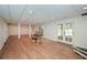 Large basement with double doors, wood flooring, and recessed lighting at 805 Wesley Oak Rd, Atlanta, GA 30328