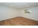 Spacious basement featuring wood flooring, recessed lighting, and a window at 805 Wesley Oak Rd, Atlanta, GA 30328