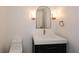 Modern bathroom with a vessel sink, elegant lighting, and updated fixtures at 805 Wesley Oak Rd, Atlanta, GA 30328