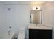 Bathroom features a vanity, mirror, tub and shower combination at 805 Wesley Oak Rd, Atlanta, GA 30328