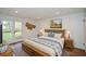 Cozy bedroom features french doors, a large bed, and neutral tones at 805 Wesley Oak Rd, Atlanta, GA 30328
