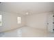 Bright bedroom featuring two windows with natural light and ceiling fan at 805 Wesley Oak Rd, Atlanta, GA 30328