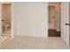 An empty bedroom with white walls and doorways to the ensuite bathroom and an adjacent room at 805 Wesley Oak Rd, Atlanta, GA 30328