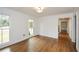 Light-filled bedroom with hardwood floors and view to the hallway at 805 Wesley Oak Rd, Atlanta, GA 30328