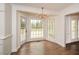 Bright breakfast nook with bay window, door to deck, and a view of the pool at 805 Wesley Oak Rd, Atlanta, GA 30328