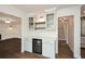 Elegant dining area with custom bar, wine cooler, and seamless access to stairs at 805 Wesley Oak Rd, Atlanta, GA 30328