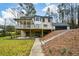 Exterior view of a home with a large covered deck overlooking the backyard at 805 Wesley Oak Rd, Atlanta, GA 30328