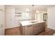 New kitchen island with quartz countertop, stainless sink, and gold faucet at 805 Wesley Oak Rd, Atlanta, GA 30328