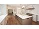 Open kitchen showcasing a large island with countertop, and range at 805 Wesley Oak Rd, Atlanta, GA 30328