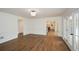 Open-concept living room with hardwood floors and views to the kitchen at 805 Wesley Oak Rd, Atlanta, GA 30328