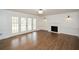 Bright, open living room with hardwood floors and French doors leading to the deck at 805 Wesley Oak Rd, Atlanta, GA 30328