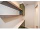 Pantry features floating shelves, white counters, and green cabinets for optimal storage at 805 Wesley Oak Rd, Atlanta, GA 30328