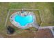 Aerial view of a private fenced in kidney-shaped swimming pool at 805 Wesley Oak Rd, Atlanta, GA 30328