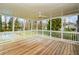 Covered porch with plenty of room, looking out on the lawn and trees at 805 Wesley Oak Rd, Atlanta, GA 30328