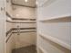 Modern walk-in shower with black and white mosaic tile design, glass enclosure, and wall storage at 805 Wesley Oak Rd, Atlanta, GA 30328