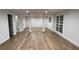 Finished basement features new floors, white trim, and large windows for ample natural light at 805 Wesley Oak Rd, Sandy Springs, GA 30328